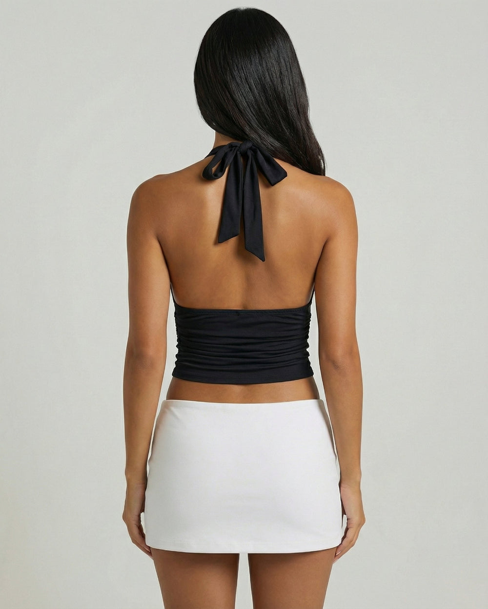 Back view of black halter neck top