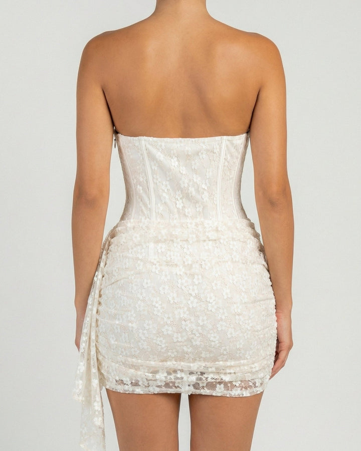 White corset lace mini dress back view with fitted silhouette and lace detailing