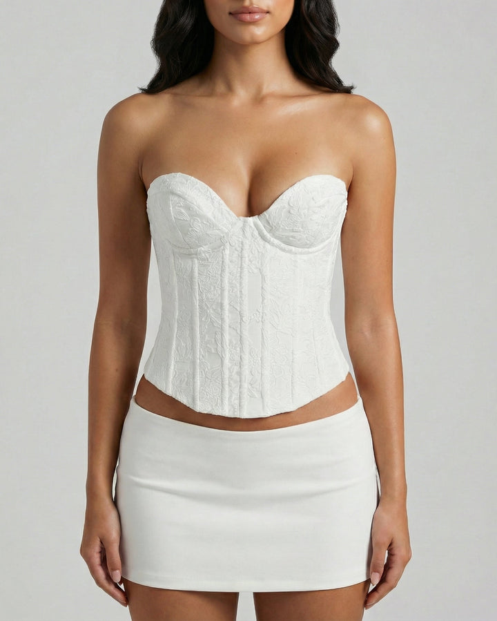 Front view of floral embroidered white corset top