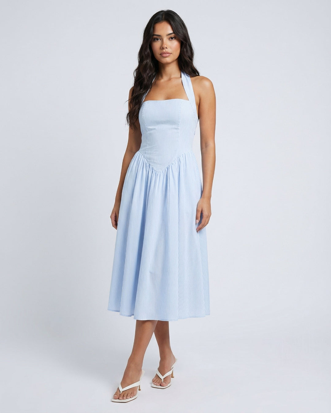 Front view of light blue stripped midi dress in a white background